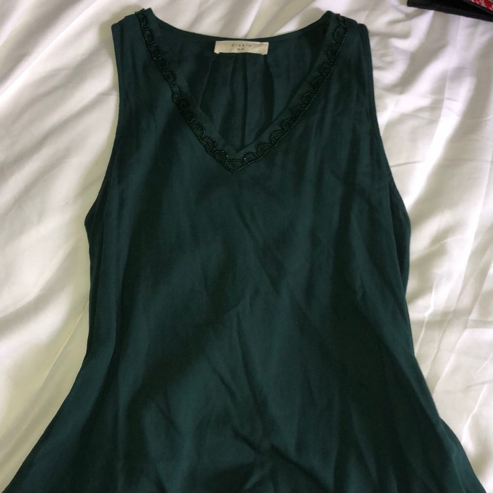 green sleeveless shirt